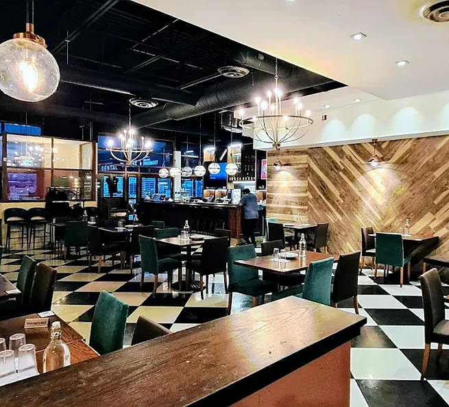 Dining room and bar with chandeliers at Bawarchi in Mississauga